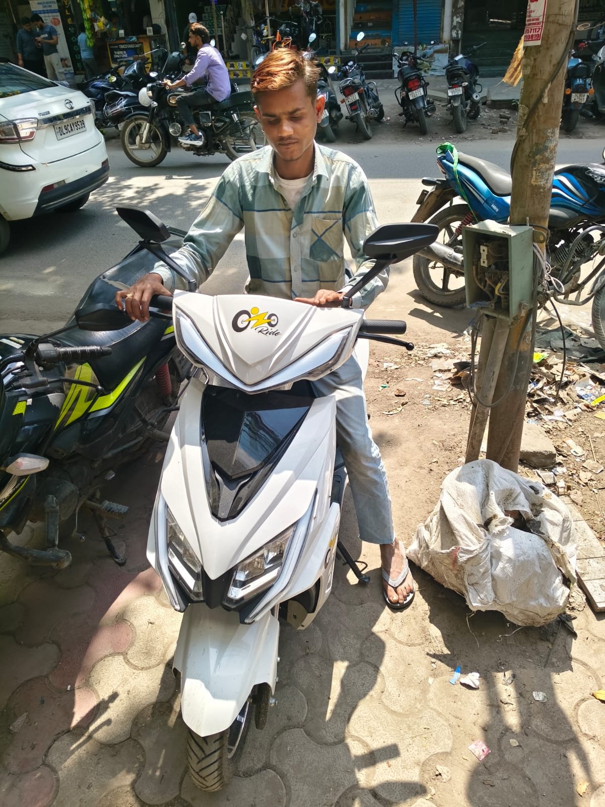 Ozoride rider field operation with white electric scooty